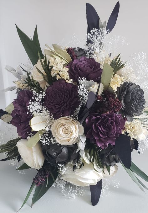 This beautiful mix of sola flowers, hand- dyed a plum and charcoal color, are accented with gorgeous preserved and dried greenery.  Pictured is an 8 inch bridal.  Handle is wrapped in lace. Last picture shows the cascade option. To purchase matching boutonnieres, look here: https://www.etsy.com/shop/mydinosaurdreams/?section_id=21264911 https://mydinosaurdreams.etsy.com/listing/1097749518/plum-and-ivory-boutonniere-sola-wood https://www.etsy.com/listing/918127986/plum-boutonniere-purple-sola-woo Flower Bouquet Dark, Purple Flowers Wedding, Dried Greenery, Dark Purple Wedding, Lilac Wedding Bouquet, Purple Bouquets, Dark Purple Flowers, Wood Flower Bouquet, Purple Wedding Bouquets