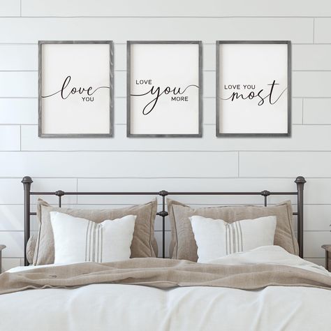 PRICES MAY VARY. SET OF 3 BEDROOM SIGNS: One set includes 3 popular bedroom sayings plaque, each one says: "Love You" "Love You More" “Love You Most”. The frame of the bathroom sign is made of wood that is sturdy and durable. It’s 11*14 inches in size, and 3 pieces of them, which is great for bigger bed and space. EASY TO INSTALL: The wood bedroom wall decor is a lightweight piece making it easy as pie to hang! Not too many holes in the wall required to keep it up. 4 Screws are included in the p Signs For Couples Wall Art, Above The Bed Farmhouse Signs, Signs Over Bed Master Bedrooms Rustic, Above The Bed Guest Room, Bedroom Sayings Wall Art Farmhouse, Wedding Photo Above Bed Master Bedrooms, Sign Over Guest Bed, Cute Sign For Above Bed, Bedroom Photo Frames Above Bed