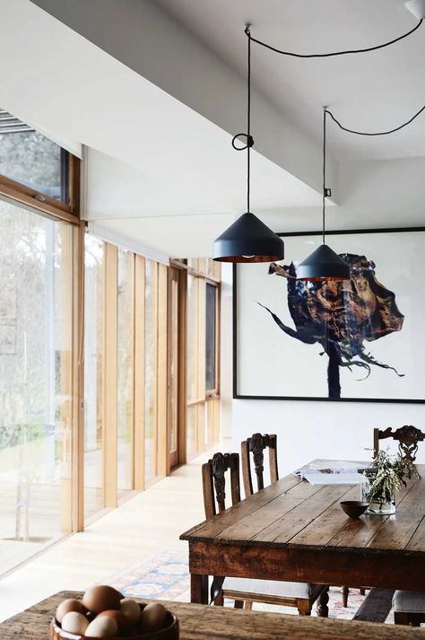 An Australian farmhouse with modern timber extension Timber Extension, Australian Farmhouse, Dog Window, Porthole Window, Lunch Table, Island Bench, Timber Veneer, Warm Decor, Grey Flooring