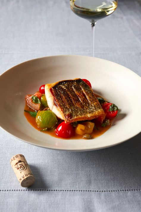 67 Pall Mall's fillet of wild sea bass with heritage tomatoes, anchovies and capers  | Lunch and Dinner | Recipes | Luxury London Heritage Tomatoes, Top Chef Recipes, Sea Bass Recipes, Lunch And Dinner Recipes, Wild Sea, Wine And Food, Bistro Food, Fine Dining Recipes, Pub Food