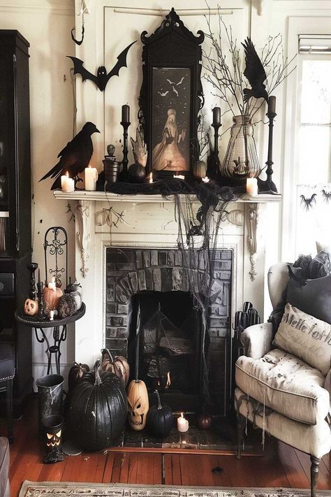 Create an enchanted Halloween scene with magical fireplace decor. Pumpkins, bats, and mystical elements bring a fairy-tale feel to your living room. Check out more Halloween fireplace decor living room ideas and follow us for more inspiration! Halloween Living Room Decor, Halloween Mantel Decor, Halloween Mantle Decor, Halloween Fireplace, Halloween Living Room, Victorian Halloween, Halloween Decor Diy, Halloween Decor Ideas, Halloween Mantle