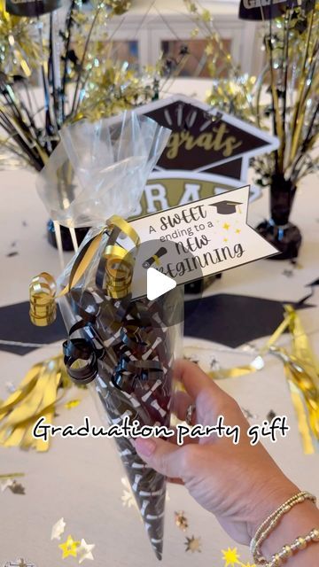 Felicia Pettit | CREATING PARTIES & GIFTS on Instagram: "🎓 Graduation Party Gift Idea! 🎓
Celebrate your grad’s big day with a creative and thoughtful gift cone! 🌟
What you’ll need:
- Graduation-themed paper
- Gift card (of your choice)
- Delicious chocolates

**Instructions:**
1. Roll the graduation paper into a cone shape and secure it with tape or glue.
2. Place the gift card inside the cone.
3. Add chocolates to fill up the cone.
4. Personalized gift tag 

✨comment “SWEET” for printable✨

These gift cones make perfect party favors or a special surprise for the graduate. Simple to create and packed with joy! 🎉

#graduationparty #giftideas #DIY #graduation2024 #celebratesuccess #giftidea #diygifts #gift #gifts #partyideas #party #partyfavors" Graduation Day Gift Ideas, Graduation Candy Gift Ideas, How To Make Cones From Paper, High School Graduation Gift Ideas Diy, Graduation Ideas For High School, Graduation Party Favors Diy, Graduation Party Favor Ideas, Graduation Gifts For High School, High School Graduation Gift Ideas