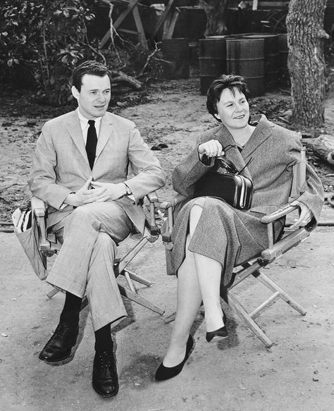 Watching the filming of a scene for the movie are producer Alan Pakula and Harper Lee.