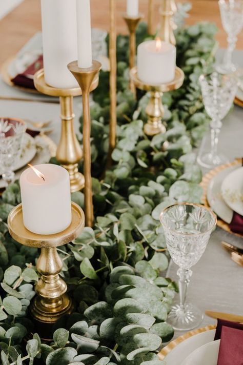 eucalyptus table runner - photo by Kai Heeringa Photography http://ruffledblog.com/modern-romantic-wedding-ideas-with-marsala Eucalyptus Wedding Decor, Gold Winter Wedding, Greenery Wedding Centerpieces, Rustic Wedding Decorations, Winter Wedding Inspiration, Eucalyptus Wedding, Gold Candles, Wedding Table Decorations, Deco Floral