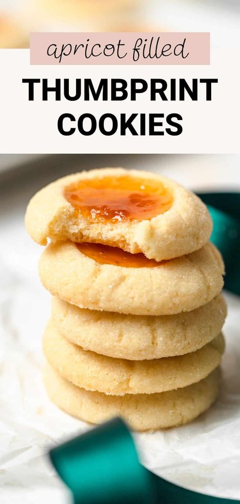 These apricot thumbprint cookies are so simple and tasty. They're made with a shortbread-like dough filled with tart apricot preserves or jam that balances the sweetness beautifully. They're perfect for any Christmas cookie box! Apricot Thumbprint Cookies Recipe, Apricot Filling Recipe, Apricot Cookies Recipe, Apricot Preserves Recipe, Apricot Dessert, Apricot Preserves, Milk Chocolate Chip Cookies, Christmas Cookie Box, Apricot Recipes