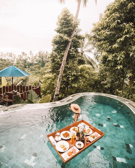 A combo of floating breakfast and fantastic morning view creates an unforgettable experience. ✨  📍Kamandalu Ubud, Bali  📸@nanagnwn Floating Breakfast, Bali Travel Photography, Honeymoon Tour Packages, Bali Honeymoon, Voyage Bali, Honeymoon Tour, Bali Hotels, Flower Bath, Inclusive Resorts