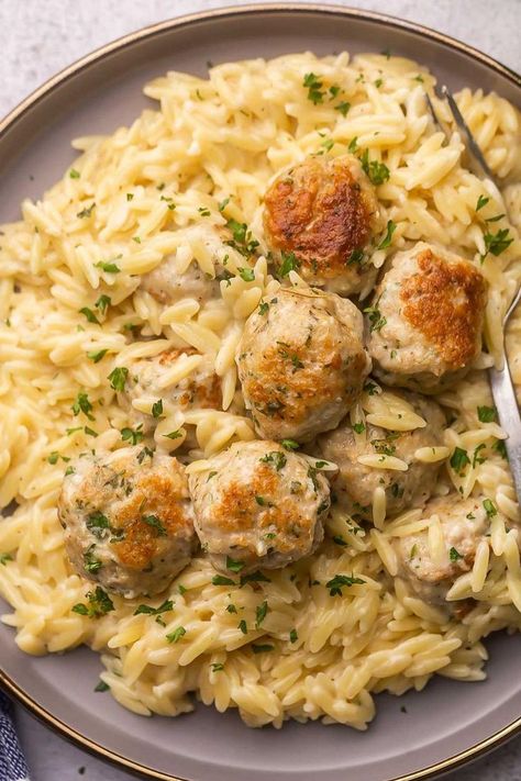 "An enticing image featuring Chicken Meatballs served on a bed of creamy Garlic Parmesan Orzo, a flavorful and comforting dish." Chicken Meatballs And Risotto, Crockpot Garlic Butter Chicken Meatballs With Orzo, Chicken Meatball Gnocchi, Swedish Meatball Orzo, Instant Pot Chicken Meatballs, What To Make With Chicken Meatballs, Chicken Meatballs And Orzo, Store Bought Meals, Chicken Meatball Casserole