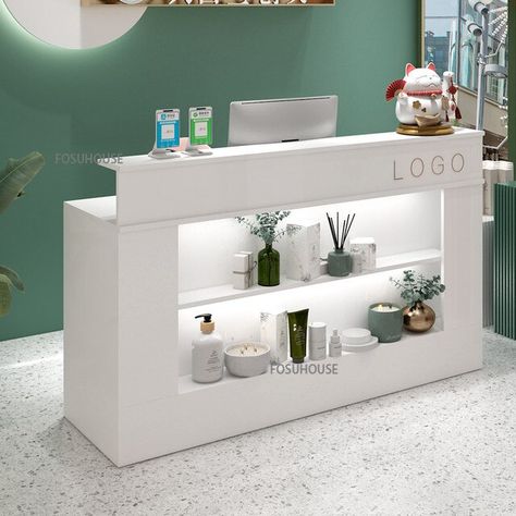 Front Desk For Salon, Spa Counter Reception Desks, Reception Desk With Glass Display, Products Display Design, Reception Desk With Display Shelves, Spa Desk Reception Areas, Salon Checkout Counter, Store Desk Design, Modern Store Interior Design