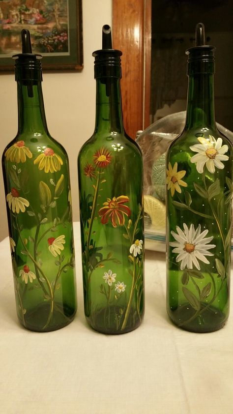 Hand painted wine bottles by Denise Crawford Green Glass Bottles Art, Flower Painted Wine Bottles, Vine Bottle Crafts Diy, Green Glass Bottles Decor, Green Bottle Decor, How To Paint A Wine Bottle, Green Glass Bottle Painting, Green Bottle Painting, Empty Wine Bottle Ideas