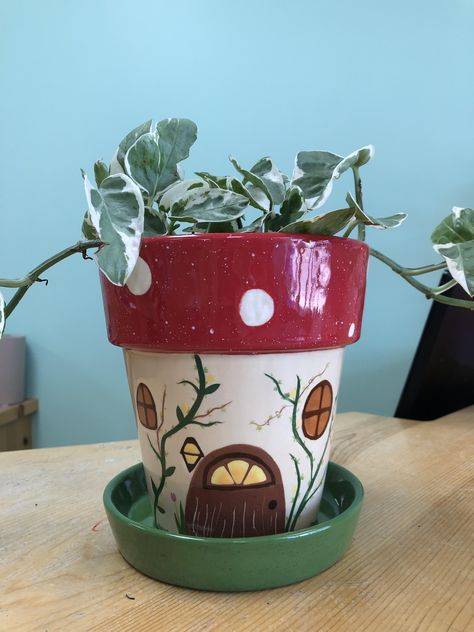 Gnome home style plant pot #potterypainting #ceramcs #paintyourownpottery #flowerpot #paintingideas Cute Clay Pot Painting Ideas, Fairy House Pottery Painting, Animal Painted Pots, Succulent Pot Ideas Paint, Cottage Core Plant Pots, Mothers Day Plant Pot, Drawing On Plant Pot, Pottery Planter Painting Ideas, Painting Pot Plants