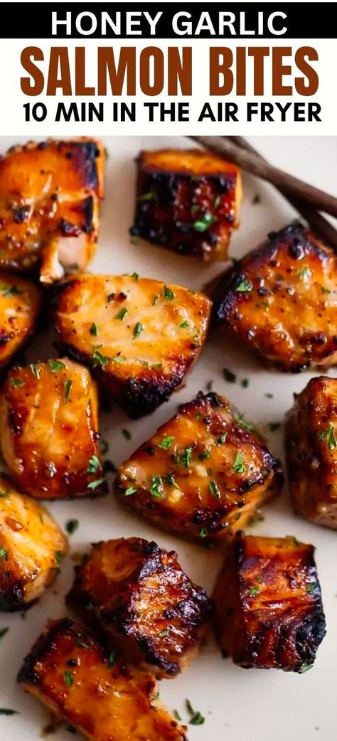 This quick and easy recipe for healthy Air Fryer Honey Garlic Salmon Bites offers succulent, bite-sized pieces of salmon coated in a sweet and garlicky sauce, cooked to perfection in your air fryer or Ninja Foodi in under 15 minutes! Make for meal prep and serve with rice, quinoa, in a stir fry, or on top of steamed vegetables! Cubed Salmon Air Fryer, Airfryer Salmon Bowl, Juicy Salmon Recipes, Airfryer Meal Prep, Fish Air Fryer Recipes, Ninja Dual Air Fryer Recipes, Fast Dinners Easy, Salmon Air Fryer Recipes, Honey Garlic Salmon Bites