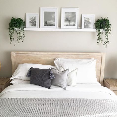 Image from Kmart Hack Queen 👸🏼 on Instagram - I love the picture rail idea above the bed 🥰 Bedroom Decor Above Bed Ideas, Frame Above Bed Ideas, Over Bed Frame Decor, Shelf With Picture Frames Above Bed, Large Pictures Above Bed, Decor Above Queen Bed, Picture Ledge Above Mirror, Diy Shelf Over Bed, Simple Above Bed Decor