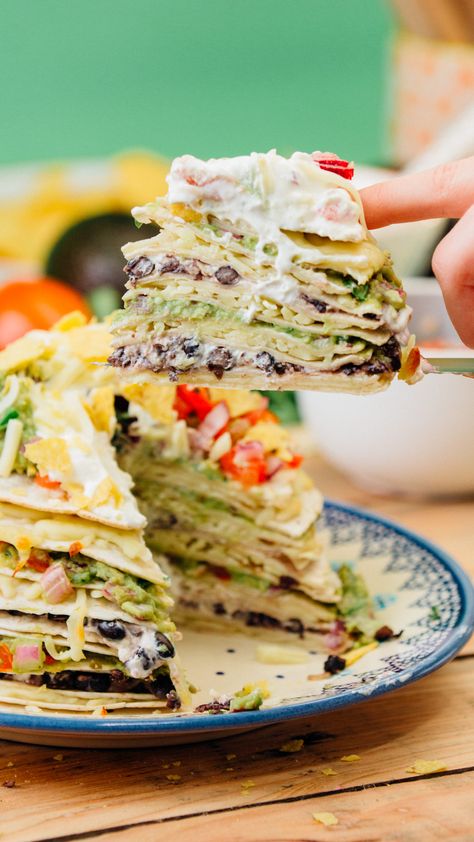 Kate's Mexican inspired tortilla stack is the perfect dish to feed tonnes of hungry friends at your next movie night! It's stacked high with cheese, guacamole and all your favourite toppings! Tortilla Stack, Mexican Favorites, Mexican Tortilla, Mexican Night, Your Next Movie, Recipes Authentic, Tortilla Wraps, Mexican Food Recipes Authentic, Baking Tins