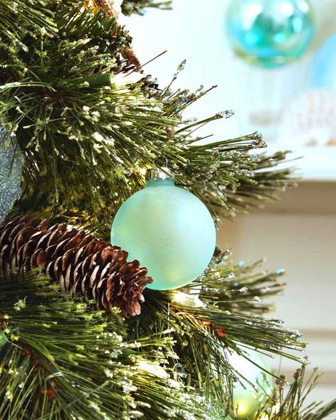 Sea Glass Holiday Tree Ornaments | Martha Stewart Living — We used specialty sea glass paint in order to give glass ornaments a frosted aqua-colored effect.\ Sea Glass Paint, Sea Glass Ornaments, Glass Paint, Glass Ball Ornaments, Sea Glass Crafts, Coastal Christmas, Seashell Crafts, Handmade Christmas Ornaments, Diy Holiday