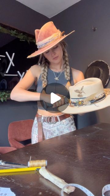 Alexa Wisnieski on Instagram: "Help me name this rose petal pinch silver-belly!  *custom order*  This beautiful custom included leopard print and a humming bird engraving with pops of teal, tans, browns and black bands. I absolutely loved working on this one!  . . #hatter #hatmaker #customhat #creativeprocess #process #nashville #nashvilletn #tn #tennessee #countrymusic #country #art #artist #handmade #customhat #millinery #milliner #tn #newmusic #satisfying #howitsmade #lexlynne" Decorate Cowboy Hats Diy, How To Make A Felt Hat, How To Paint A Felt Hat, Hat Feathers Diy, Decorated Hats Ideas, Hatbands Ideas, Hairstyles For Cowboy Hats, Decorating Cowboy Hats, Hairstyles With Cowboy Hats