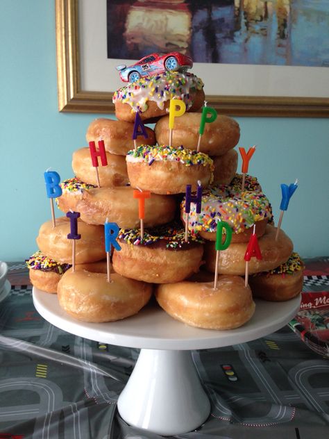 Birthday Doughnut Cake, Birthday Dessert Display Ideas, Doughnut Cake Birthday Tower, Krispy Kreme Donut Cake Birthdays, Birthday Donut Display, Donuts Instead Of Cake Birthday Parties, Dounat Birthday Cake, Donuts Cake Ideas, Donought Cake