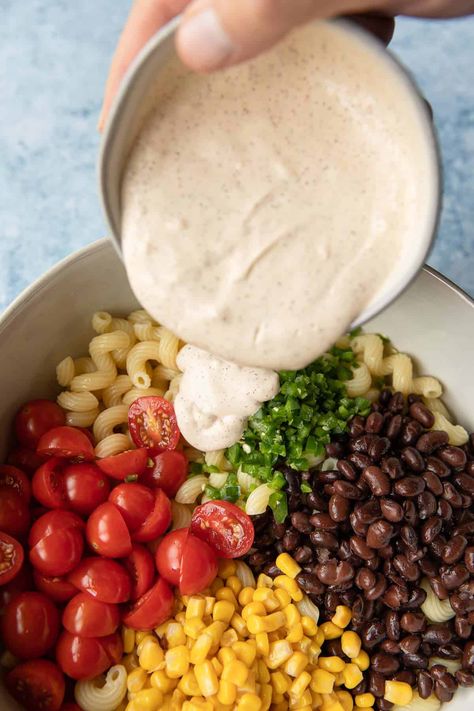 There's much to love in this Mexican inspired corn and black bean pasta salad. Similar to fiesta pasta salad, this dish is filled with corn, black beans, tomatoes, and is mixed with a delicious, creamy southwestern chili lime dressing. Black Bean Pasta Salad, Mixed Bean Recipes, Bean Pasta Salad, Southwestern Chili, Salad With Chili, Corn And Bean Salad, Southwest Pasta Salad, Bean Pasta Recipes, Mexican Pasta Salad