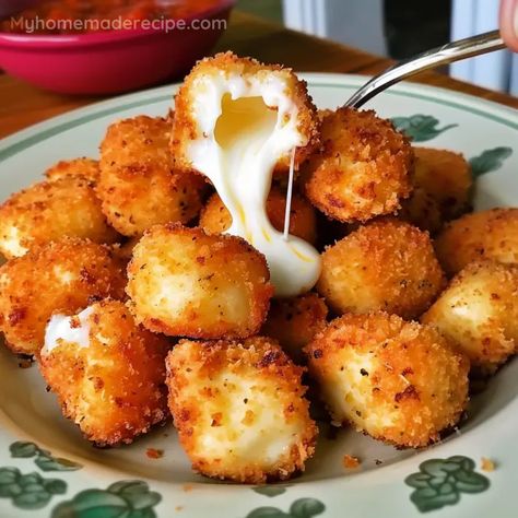 These Easy Fried Cheese Bites are made from mozzarella string cheese, coated in a crispy bread crumb layer, and fried to golden perfection. A perfect snack or appetizer. Homemade Fried Cheese Curds, Deep Fried Cheese Curds Recipe, Easy Fried Cheese Bites, Cheese Curds Fried, String Cheese Recipes, Fried Cheese Sticks Mozzarella, Fried Cheese Bites, Fried Cheese Curds, Prepared Eggs