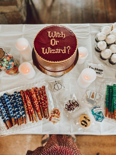 This was my sweets table from my Harry Potter themed baby shower. 
Witch or wizard (gender) reveal cake, chocolate covered pretzels decorated in the house colors, chocolate frogs, chocolate covered strawberries decorated like golden snitches, Fizzing whizbees (sweet tarts), Bertie botts every flavor beans, sugar cookies and cupcakes. Witch Or Wizard Gender Reveal, Bertie Botts Every Flavor Beans, Harry Potter Shower Ideas, Fizzing Whizbees, Harry Potter Themed Baby Shower, Baby Shower Sweets Table, Baby Reveal Cakes, Creative Gender Reveals, Harry Potter Theme Birthday