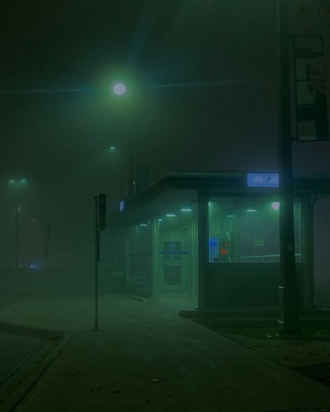 This shows a bus stop that’s lit in an eerie green foggy way. Foggy Nights Aesthetic, Green Foggy Aesthetic, Dark Foggy Aesthetic City, Dark City Photography, Foggy City Night, Foggy Green Aesthetic, Foggy Liminal Space, Foggy Aesthetic City, Foggy City Aesthetic