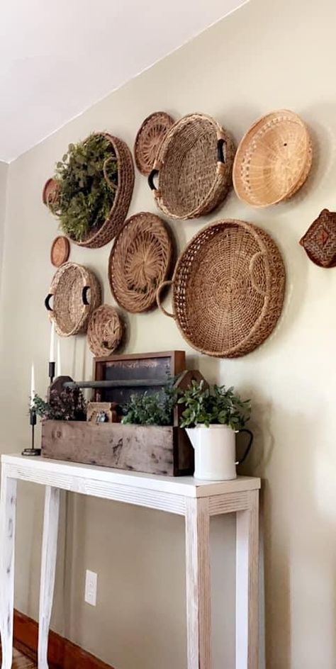 Boho Basket Wall Decor Ideas, Basket Accent Wall, Boho Wall Living Room, Lower Wall Decor Ideas, Boho Farmhouse Living Room Wall Decor, Farmhouse Basket Wall Decor Ideas, Decorating Walls With Baskets, Baskets On Wall Decor Farmhouse Style, Basket Wall With Picture