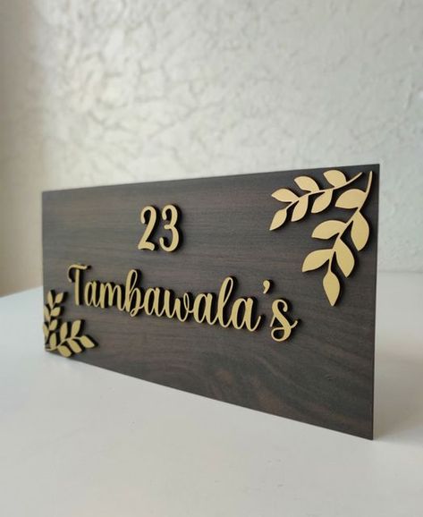 Wooden Nameplates Design, Ideas For Name Plate, Wooden Name Plates For Home Doors, Wooden Name Plate Design, Entrance Name Plate Design Modern Indian, Home Plate Design, Home Nameplate Design, House Name Plates Design, Wood Name Plates For Home