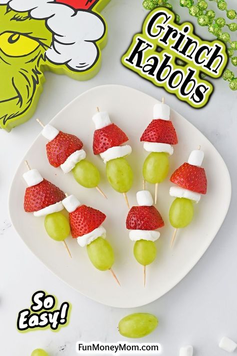 These Grinch kabobs are a simple and healthy holiday snack that you can make in minutes. Perfect for both kids and adults, these fun Christmas bites are sure to become one of your go-to holiday treats! Christmas Fruit Skewers Ideas, Grinch Grapes And Strawberries, Grinch Hats Fruit, Healthy Grinch Snacks For Kids, Red And Green Snacks, Grinch Kabobs Christmas, Christmas Snack Board For Kids, Christmas Fruit Kabobs Kids, Grinch Skewers