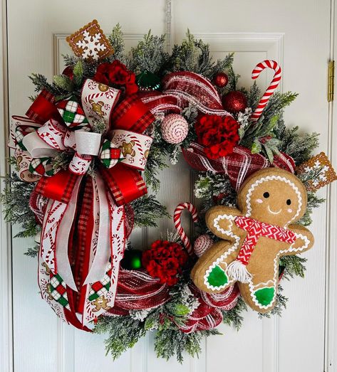 If you're seeking a traditional Christmas wreath to adorn your front door, this red, white, and green design is ideal. A Gingerbread Man wreath is also a great choice for festive decor. This shiny, glittery wreath will make a stunning statement on your door for years to come. Traditional Christmas colors evoke a warm, festive atmosphere. I personally prefer classic red and green for my holiday decor. This Gingerbread Man wreath will be a perfect choice to greet guests for many Christmases. My de Christmas Wreaths Design, Christmas Wreaths On Doors, Home Made Christmas Wreath Ideas, Gingerbread Men Wreath, Red And Green Wreath, Gingerbread Christmas Wreaths, Christmas Door Reefs, Evergreen Wreaths For Christmas, Dollar Tree Wreath Ideas Christmas Decor