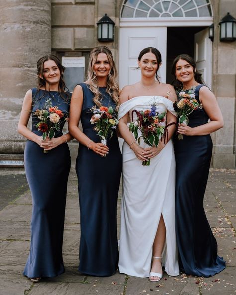 Celebrating Mr & Mrs Brady-Thompson 🤩 💍 Take a look at these gorgeous bridesmaids wearing our 'Joy in Midnight Navy Satin'... we are in LOVE with how they look! Wearing our Olivia & Rose dresses to an upcoming wedding? Don't forget to tag us in your photos or send them to us via DM for a chance to be featured on our page! 💌 📸 : @bohemianrosephotography Navy And Gold Wedding Party, Navy Bridesmaid Dresses With Groomsmen, Navy Bridesmaid Dresses Mismatched, Bridesmaid Dresses With Navy Suits, Mismatched Navy Bridesmaid Dresses, Navy Bridal Party, Bridesmaid Dress Navy Blue, Navy Bridesmaids Dresses, Navy Bridal Parties