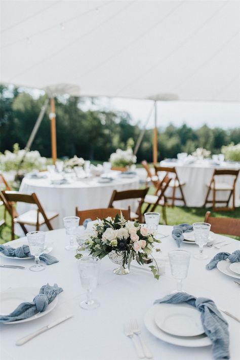 Minimalist Wedding Table Design Inspiration | Dusty Blue Gauze Napkins with Blush and White Floral Centerpieces in a silver compote Slate Blue Wedding Centerpieces, Dusty Blue And White Wedding Table Settings, White Dusty Blue Wedding, Dusty Blue Candle Centerpieces, Dusty Blue Bud Vases Wedding, Stone Blue Wedding, Dusty Blue And Silver Table Setting, White And Dusty Blue Table Setting, Dusty Blue Green And White Wedding