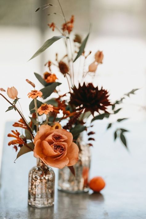 Rustic Orange Wedding Flowers, Rustic Wedding Bouquet Fall Color Schemes, Autumn Wedding Chair Decorations, Fall Flower Table Decor, Simple Autumn Centerpieces, Terracotta And Eucalyptus Wedding Flowers, Orange Fall Wedding Flowers, Rust Orange Wedding Centerpieces, Wedding Flowers Fall Rustic