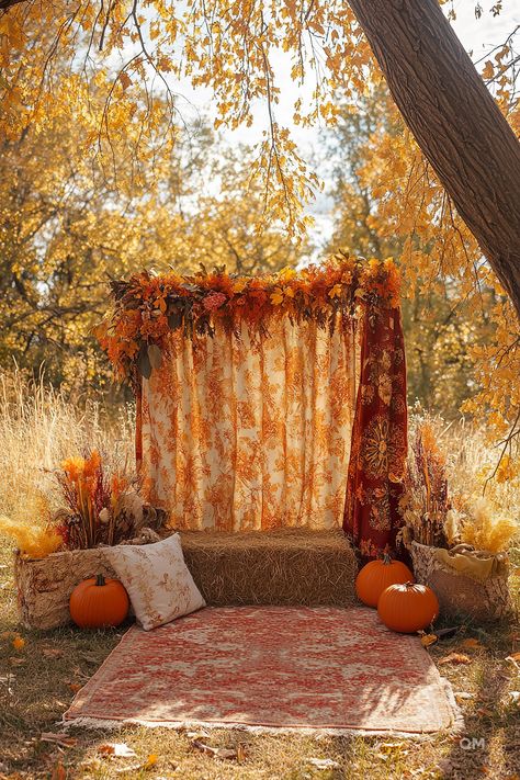 Cozy fall decor setup in the woods with pumpkins, a rustic hay bale seat, and autumn-themed drapes. Perfect inspiration for fall decorating ideas. Fall Decor For Photo Shoot, Harvest Festival Photo Backdrop, Fall Mini Sessions Hay Bales, Indoor Fall Mini Session Ideas, Simple Fall Photo Backdrop, Easy Fall Photo Backdrop, Studio Fall Mini Sessions, Diy Fall Photo Backdrop, Outdoor Studio Photography