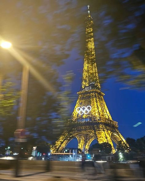 the olympic rings have been installed on the eiffel tower for the paris olympics, adding a stunning new look to the iconic landmark. these rings symbolize the unity and spirit of the games as paris prepares to host athletes from around the world. - #parisolympics #eiffeltower #olympicrings #paris2024 #olympics #cityoflights #sportingevent #iconiclandmark #paris #historyinthemaking #flawdforge Olympic Rings Aesthetic, Eiffel Tower Olympics 2024, Paris Olympics Aesthetic, Eiffel Tower Olympics, Olympics Aesthetic Paris 2024, The Eiffel Tower Aesthetic, Olympics Paris 2024, Olympics 2024 Paris, Travel Around The World Aesthetic