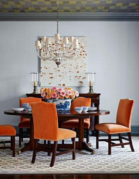 The bright orange chairs would be perfect for someone not ready to commit to permanent wall color. *Evelyn'sSunshine* Orange Dining Room Chairs, Orange Dining Room, Trendy Dining Room, Orange Chairs, Orange Chair, Dining Room Blue, Modern Dining Room Tables, Blue Living Room, Room Interior Design