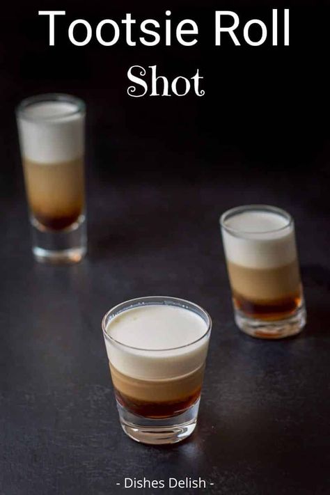 Its dense, double-chocolate flavor earned the tootsie roll shot the same name as the candy. Taste for yourself!  There are only three ingredients to this scrumptious shot! #tootsierollshot #layeredshot #dishesdelish Tootsie Roll Shot, Alcohol Shots, Camping Drinks, Cocktail Food, Alcohol Beverages, Liquor Recipes, Mimosa Recipe, Cocktail Shots, Shots Alcohol