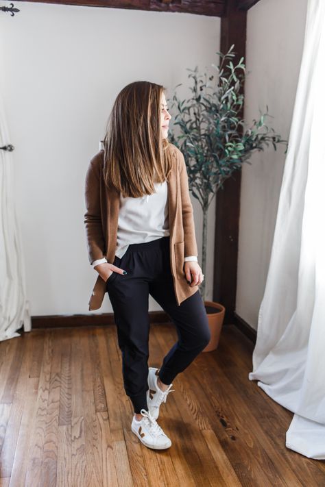 5 ways to style black joggers. Sneakers And Joggers Outfit, Womens Joggers Outfit Dressy Work, Hoodie Casual Outfit Women, Joggers With Cardigan Outfit, Tan Athletic Pants Outfit, Thanksgiving Jogger Outfit, What To Wear With Black Joggers Casual, Women Black Joggers Outfit, Black Joggers Travel Outfit