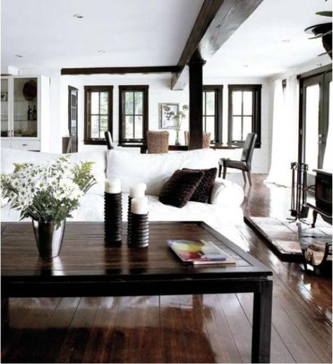 I don't tire of this look.  I would have more color throughout the room in my own house. Dark Wood Floors Living Room, White Walls Living Room, Dark Wood Trim, Cherry Wood Floors, Living Room Wood Floor, Dark Trim, Light Wood Floors, Trendy Living Rooms, Brown Living Room