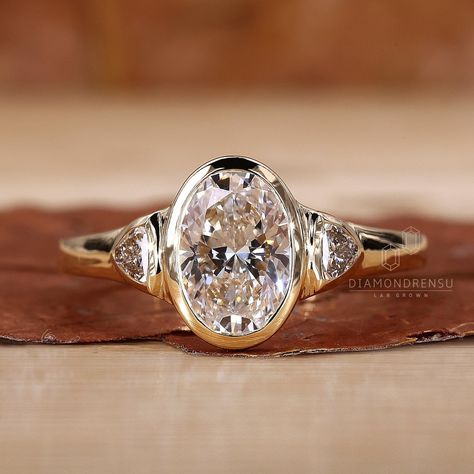 This Engagement Rings item by DiamondrensuLabgrown has 135 favorites from Etsy shoppers. Ships from India. Listed on May 28, 2024 Types Of Stone Settings, Vintage Band Engagement Ring, Old Mine Cut Bezel Ring, Art Deco Oval Ring, Inset Diamond Ring, 3 Stone Bezel Set Ring, Three Stone Bezel Set Ring, Oval Bezel Set Engagement Ring, Oval Bezel Engagement Ring