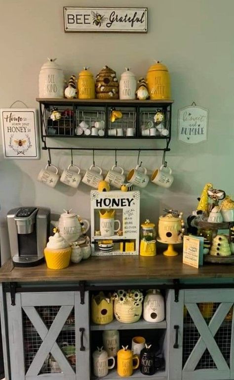 Pin by Ricci Wheeler on 1 Rae Dunn in 2022 | Kitchen decor, Honey bee decor, Bee decor Bee Kitchen Theme, Sunflower Themed Kitchen, Rae Dunn Display, Dining Room Credenza, Bee Room, 2022 Kitchen, Credenza Decor, Sunflower Kitchen Decor, Lemon Kitchen Decor