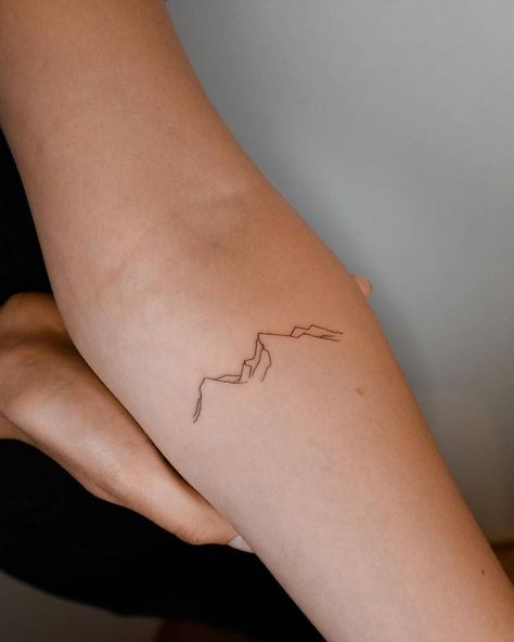 Elegant Mountain Tattoo, Peru Inspired Tattoos, Finger Mountain Tattoo, Small Outdoorsy Tattoos, Hills And Valleys Tattoo, Mountain Wrist Tattoo, Iceland Tattoo Ideas, Minimalist Nature Tattoos, Minimalist Mountain Tattoo