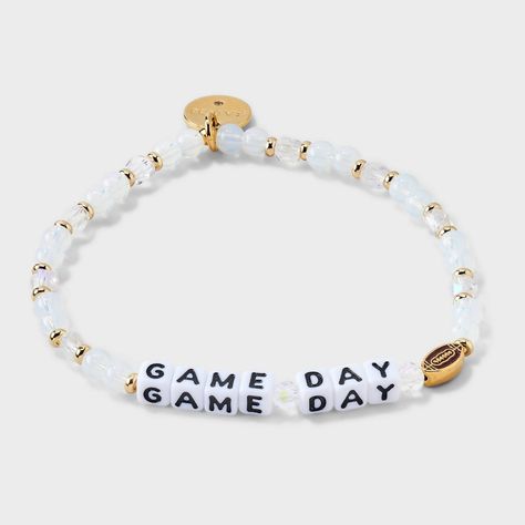 Tagline: All fun and games Description: Get your game face on and your wrist ready with our exclusive "Game Day" bracelet from Little Words Project® featuring a custom football casted bead. This sporty accessory is a great way to celebrate your love of the game and keep a winning attitude all day long. This Little Word™is more than just a bracelet. It’s your key to inspiring a kinder world. Wear your word as long as you need it. When you’re ready, pass it on to someone else who needs it more. Ea School Beaded Bracelets, Beaded Bracelets Sayings, Game Day Bracelets, Bead Bracelet Ideas Words, Bead Bracelet Words Ideas Bad, Falcon Jewelry, Little Words Project Bracelets, Bracelet Stuff, Little Words Project