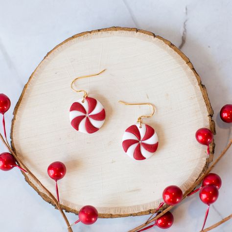 Christmas/Holiday Peppermint Candy Earrings, Lightweight Festive Dangle Earrings, Handmade Polymer Clay Earrings Polymer clay earrings are extremely lightweight and comfortable to wear. These earrings are handmade, so you may notice slight variations in the product pictured and the one you receive. The hooks are gold plated over brass, silver hooks are available upon request. ▪CARE INSTRUCTIONS▪ Store your earrings in a way where the metal backs will not scratch your clay earrings. Avoid sleeping in or bending your earrings. Polymer clay earrings are very durable, but can break if force is applied. If needed, you can clean them with a damp cloth or baby wipe.  If you have any questions, please feel free to message me! ♡ Polymer Clay Christmas Candy, Holiday Clay Ideas, Christmas Polymer Clay Earings, Clay Earrings Holiday, Christmas Clay Earrings Ideas, Polymer Clay Christmas Earrings Diy, Christmas Clay Earring Ideas, Christmas Earrings Clay, Christmas Earrings Polymer Clay