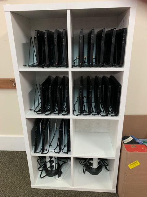 IKEA bookcase, file holders and cable tie downs. Student Laptop Organization, Ipad Storage Ideas, Classroom Ipad Storage Ideas, Classroom Device Storage, Multiple Laptop Storage Ideas, Classroom Laptop Organization, Classroom Ipad Charging Station, Classroom Computer Storage, Chromebook Organization In The Classroom