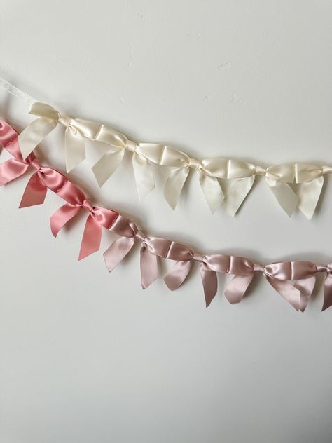 This dainty bow garland is perfect for decoration for any occasion. Use it for bridal parties, bachelorette weekends, baby showers, teen birthday parties, or even to decorate a little girl's room. Each bow is 3.5" wide and is tied off with ribbon on each end for convenient hanging.  Please select your desired length and color when ordering. Further customization available upon request! Just send me a message when ordering and we'll create something beautiful. Returns may be limited for customize Girly Party Decor, Nursery Baby Girl, Bow Garland, Decor For Nursery, Bow Baby Shower, Eagle Mountain, Deco Studio, Birthday Party For Teens