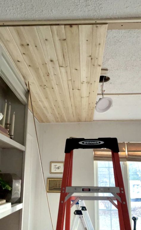 Cedar Planks Over Popcorn Ceiling PT1 - Made by Carli Beams On Half Vaulted Ceiling, Planking Ceiling Diy, Ceiling Farmhouse Ideas, Gambrel Ceiling Ideas, Wood Plank Basement Ceiling, Ceiling Shiplap Diy, Wood Ceiling Beach House, Redo Ceiling Ideas, Finishing Basement Ceiling