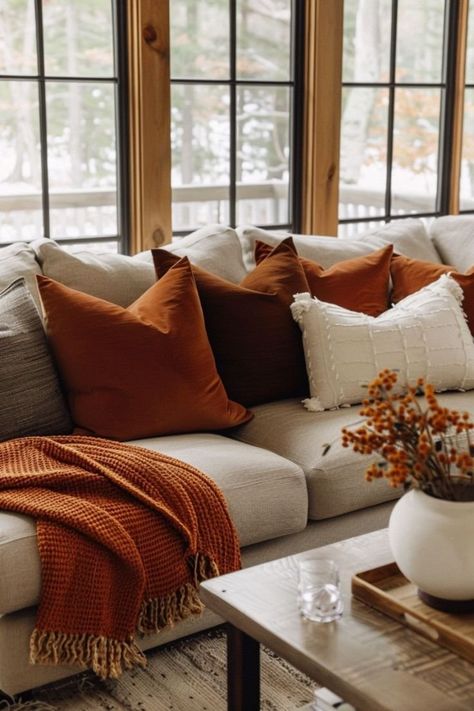 Orange Rustic Living Room, Burnt Orange Living Room Accents, Tan And Rust Living Room, Brown And White Fall Decor, Rustic Orange Home Decor, Living Room With Burnt Orange Accents, Burnt Orange Apartment Decor, Fall Color Home Decor, Burnt Orange Lounge Decor