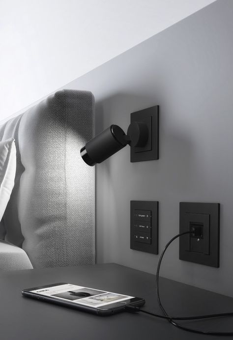 Lighten up: Plug & Light | News Bed Reading Light, Black Light Switch, Bedroom Reading Lights, Modern Light Switches, Headboard Lamp, Light Switches And Sockets, Hotel Room Design, Smart Home Design, Modern Lighting Design