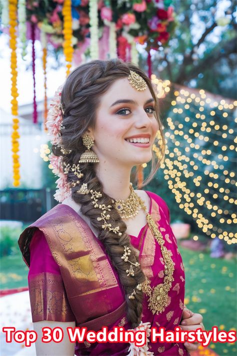 Discover the charm of elegant South Indian wedding hairstyles that are sure to turn heads on your special day. This stunning hairdo, featuring intricate braids adorned with fresh jasmine flowers, embodies the rich cultural heritage and beauty of South Indian traditions. Perfect for brides who wish to blend tradition with modern elegance, this hairstyle radiates grace and sophistication. Explore the endless possibilities for your wedding hairstyles! #weddinghairstyles #SouthIndianHairstyles South Hairstyles Indian Weddings, Side Braid Hairstyles Indian Wedding, Wedding Lehenga Hairstyles, Bridal Hairstyle Indian Wedding Braids, Wedding Function Hairstyles Indian, Traditional Bride Hairstyle, Wedding Braid Indian, Braided Hairstyles For Bride Indian, Hairstyles With Jasmine Flowers Indian