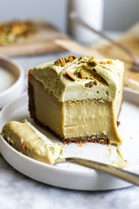 This ultra silky pistachio cheesecake is made in just a food processor with the simplest dairy free ingredients- and no eggs nor pudding mixes! Baked in a graham cracker pistachio crust and topped with pistachio cream cheese frosting! Pistachio Lava Cake, Pistachio Cheesecake Recipe, Pistachio Cheesecake, Pistachio Dessert, Raw Pistachios, Gluten Free Graham Crackers, Epicure Recipes, Pistachio Butter, Breakfast Bread Recipes