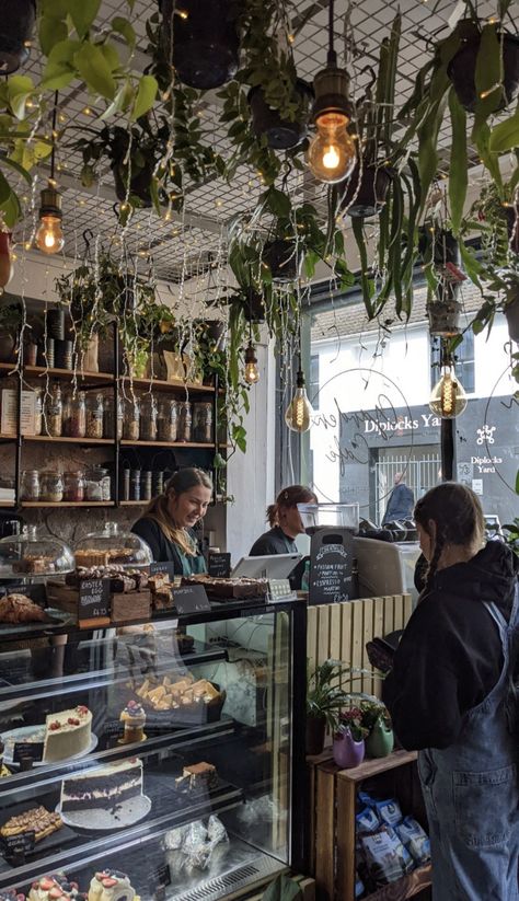 Aesthetic Cafe Design Interior, Bookstore Aesthetic Interior, Plant Coffee Shop Aesthetic, Garden Bakery, Bookstore Bakery Aesthetic, Coffee Bookstore Aesthetic, Cafe With Couches, Bakery Coffee Shop Aesthetic, Coffee Book Store Aesthetic